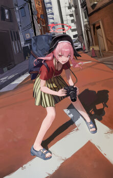 1girl absurdres alternate_costume backpack bag black_wings blue_archive blue_bag blue_sandals camera city green_skirt hair_between_eyes halo head_wings highres holding holding_bag holding_camera jianjia koharu_(blue_archive) long_hair looking_at_viewer open_mouth pink_eyes pink_hair pink_halo red_shirt sandals shirt skirt solo striped_clothes striped_skirt twintails vertical-striped_clothes vertical-striped_skirt wings