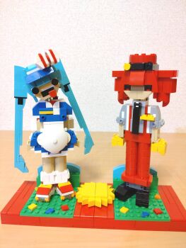 Rule 34 | 2girls, alternate costume, apron, black eyes, black footwear, black necktie, blue dress, blue hair, bow, choroli (chorolin), commentary, crazy, crazy eyes, dress, drill hair, full body, gloves, grey shirt, hair bow, hat, hatsune miku, head tilt, highres, kasane teto, lego, lego (medium), long hair, looking at viewer, mesmerizer (vocaloid), multiple girls, necktie, open mouth, pants, red eyes, red footwear, red hair, red hat, red pants, roller skates, shirt, shoes, short dress, short sleeves, skates, sleeves rolled up, socks, standing, striped bow, suspenders, tongue, tongue out, twin drills, twintails, unconventional media, utau, very long hair, vocaloid, white apron, white socks, yellow gloves