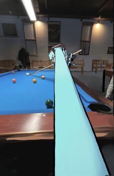 1girl absurdly_long_hair aqua_eyes aqua_hair ball bench billiard_ball billiards black_skirt ceiling_light chibi colored_shoe_soles cue_stick foreshortening hashtag-only_commentary hatsune_miku highres holding_cue_stick indoors long_hair mumu323m photo-referenced pleated_skirt pool_table prehensile_hair skirt solo table twintails very_long_hair vocaloid