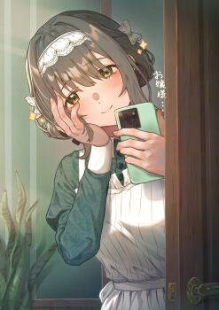 1girl absurdres apron black_ribbon blush cellphone closed_mouth door dress gakuen_idolmaster green_dress green_eyes grey_hair hair_between_eyes hair_ribbon hand_on_own_face hands_up highres hiwatari_kanae holding holding_phone idolmaster indoors long_sleeves maid_headdress phone plant potted_plant ribbon short_hair smartphone solo wari_sando white_apron