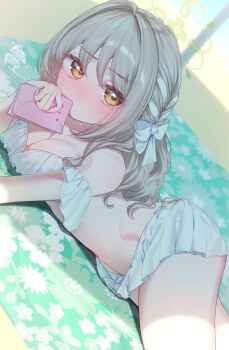 1girl absurdres alternate_costume beach beach_towel bikini blue_archive bow braid choppy_bangs covering_own_mouth frilled_bikini frills green_halo hair_ribbon halo hazel_eyes highres holding holding_notebook long_hair looking_at_viewer lying miyo_(blue_archive) nekono_moni notebook on_stomach ribbon ribbon_braid solo swimsuit towel white_bikini white_bow