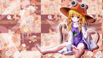1girl animal_print barefoot blonde_hair blush brown_eyes brown_hat commentary_request drop_shadow eye_on_hat eyeball feet fingernails floral_background frog_print full_body hand_on_ground hand_up hat highres kii_(mahoraba) legs_apart long_sleeves looking_at_viewer medium_hair moriya_suwako outline parted_lips purple_skirt purple_vest red_pupils red_ribbon ribbon shirt sitting skirt skirt_set sleeves_past_fingers sleeves_past_wrists smile snake solo sun_hat touhou turtleneck turtleneck_shirt vest white_outline white_shirt