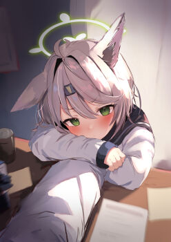 1girl absurdres ahoge animal_ears blue_archive blush brown_hair can closed_mouth commentary_request desk drink_can fox_ears fox_girl green_eyes green_halo halo headband highres holding_another's_arm long_sleeves otogi_(blue_archive) paper school_uniform serafuku soda_can sticky_note touyu_raamenn