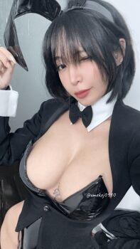 1girl artist_name black_leotard breasts cosplay cosplay_photo female_focus highres izayoi_arisa izayoi_arisa_(cosplay) kitagawa_marin kitagawa_marin_(cosplay) leotard looking_at_viewer medium_breasts one_eye_closed photo_(medium) playboy_bunny purple_hair rabbit_ears real_life sono_bisque_doll_wa_koi_wo_suru umekojcosplayer vietnamese wink