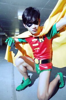 1boy batman_(series) cape cosplay dasutin dc_comics dick_grayson domino_mask eye_mask green_shoes male_focus mask photo_(medium) robin_(dc) shoes solo