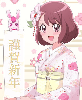 1girl animal blush brown_eyes brown_hair commentary_request flower hair_flower hair_ornament hairclip hanadera_nodoka hatsumoude healin'_good_precure highres japanese_clothes kei_yunokawa kimono long_sleeves looking_at_viewer new_year obi open_mouth precure rabbit rabirin_(precure) sash short_hair smile translation_request upper_body