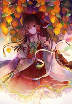 1girl bow bowtie brown_eyes brown_hair closed_mouth commentary_request detached_sleeves embellished_costume food frilled_bow frilled_hair_tubes frilled_skirt frilled_sleeves frills fruit green_bow green_bowtie hair_bow hair_tubes hakurei_reimu kazu_(muchuukai) long_hair persimmon red_bow red_skirt skirt skirt_set solo touhou