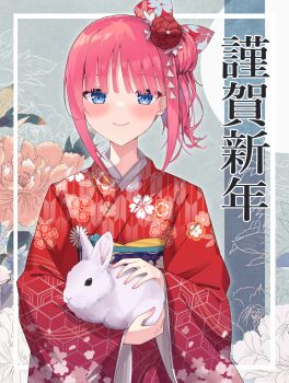 1girl animal blue_eyes blush chinese_zodiac closed_mouth floral_print flower go-toubun_no_hanayome hair_bun hair_flower hair_ornament highres holding holding_animal japanese_clothes kimono long_sleeves nakano_nino new_year obi pink_hair print_kimono profnote rabbit red_kimono sash short_hair sidelocks single_side_bun smile solo translation_request upper_body year_of_the_rabbit