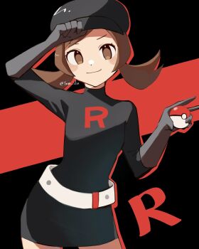 1girl belt black_background black_gloves brown_eyes brown_hair gloves grey_belt hand_on_headwear hat highres holding holding_poke_ball logo lyra_(pokemon) nintendo official_alternate_costume poke_ball pokemon pokemon_hgss smile solo team_rocket team_rocket_uniform tnm_ilu twintails
