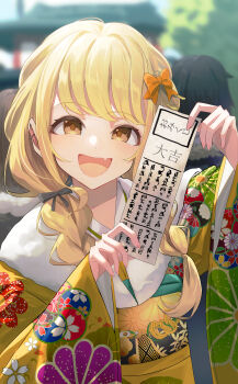 1girl a_sayu absurdres alternate_costume blonde_hair blurry blurry_background blush bow braid commentary_request fang fujita_kotone fur-trimmed_kimono fur_trim furisode gakuen_idolmaster hair_bow highres holding_omikuji idolmaster japanese_clothes kimono long_hair looking_at_viewer omikuji orange_bow outdoors people skin_fang smile solo_focus twin_braids upper_body yellow_eyes yellow_kimono