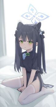 1girl :q absurdres animal_ear_fluff animal_ears bed black_hair blue_archive blush china_dress chinese_clothes closed_mouth commentary_request dress green_eyes hair_ornament halo highres lishu_(2013547716) long_hair shun_(blue_archive) shun_(small)_(blue_archive) sitting solo thighhighs tongue tongue_out twintails wariza white_thighhighs
