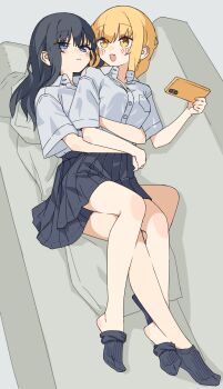 2girls absurdres black_hair black_skirt black_socks blonde_hair blue_eyes blush cellphone closed_mouth collared_shirt commentary_request couch cuddling cushion fang grey_background highres holding holding_phone hug hug_from_behind kopaka_(karda_nui) long_hair multiple_girls on_couch open_mouth original phone pleated_skirt shirt simple_background skin_fang skirt smartphone smile socks white_shirt yellow_eyes yuri