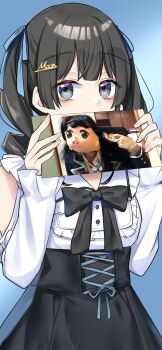 1girl black_hair black_skirt blue_background blue_ribbon commentary_request covered_mouth frilled_sleeves frills grey_eyes highres holding holding_photo looking_at_viewer multiple_hair_ribbons nijisanji pale_skin photo_(object) photo_inset ribbon sakura_yuto shirt skirt solo tsukino_mito twintails white_shirt