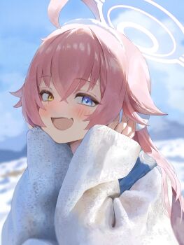 1girl :d ahoge aoteka blue_archive blue_eyes blue_sky blurry blurry_background blush commentary earmuffs fang hair_between_eyes halo heterochromia highres hoshino_(blue_archive) huge_ahoge long_hair long_sleeves looking_at_viewer open_mouth orange_eyes outdoors pink_hair pink_halo skin_fang sky sleeves_past_wrists smile solo sweater white_sweater