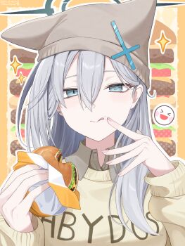&gt;_&lt; 1girl :d blue_archive blue_eyes border cardigan clothes_writing commentary cross_hat_ornament earrings eating food food_on_face grey_hair grey_shirt hair_between_eyes halo hat hat_with_ears highres holding holding_food jewelry k-d licking_lips long_hair long_sleeves looking_at_viewer mismatched_pupils open_mouth outline shiroko_terror_(blue_archive) shirt smile solo sparkle stud_earrings tongue tongue_out upper_body white_outline wing_collar xd yellow_cardigan
