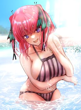 1girl arm_under_breasts bikini blue_eyes breasts butterfly_hair_ornament collarbone commentary_request floral_print floral_print_bikini go-toubun_no_hanayome hair_ornament hand_in_own_hair highres huge_breasts looking_at_viewer medium_hair nakano_nino noelia open_mouth print_bikini purple_bikini red_hair solo splashing striped_bikini striped_clothes swimsuit vertical-striped_bikini vertical-striped_clothes wading water