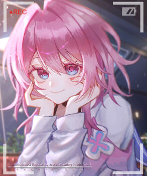 1girl battery_indicator blue_eyes blue_jacket bra_strap closed_mouth commentary_request flower_ornament hands_on_own_cheeks hands_on_own_face highres honkai:_star_rail honkai_(series) jacket long_sleeves looking_at_viewer march_7th_(honkai:_star_rail) march_7th_(preservation)_(honkai:_star_rail) medium_hair multicolored_eyes multicolored_jacket off-shoulder_jacket off_shoulder pink_eyes pink_hair pink_jacket pink_pupils recording rin1719073 shirt smile solo two-tone_eyes two-tone_jacket viewfinder watermark white_shirt