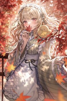 1girl apron autumn autumn_leaves blonde_hair commentary_request commission cowboy_shot day frilled_apron frilled_sleeves frills green_kimono highres holding holding_leaf japanese_clothes kimono leaf long_hair long_sleeves looking_at_viewer obi obijime original outdoors parted_lips red_eyes sakura_(39ra) sash skeb_commission solo striped_clothes striped_kimono vertical-striped_clothes vertical-striped_kimono waist_apron watermark white_apron wide_sleeves