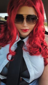 1girl artist_name black_gloves black_necktie breasts capcom car_interior closed_mouth coat cosplay cosplay_photo crimson_viper crimson_viper_(cosplay) dark-skinned_female dark_skin female_focus gloves large_breasts long_hair looking_at_viewer necktie npczoey photo_(medium) real_life red_hair red_lips smile solo street_fighter street_fighter_6 twitter_username vehicle_interior white_coat