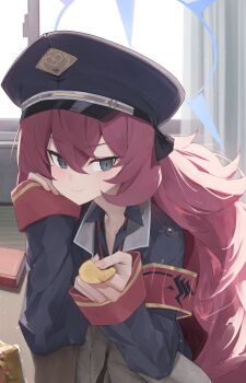 1girl armband bag_of_chips black_shirt blue_archive blue_halo blush book chips_(food) closed_mouth collared_shirt commentary_request fluffy_hair food grey_eyes hair_between_eyes halo hat highres holding holding_food indoors iroha_(blue_archive) jacket long_hair long_sleeves looking_at_viewer military_hat military_jacket necktie peaked_cap potato_chips red_armband red_hair shiroshiroghost shirt sleeves_past_wrists smile snack solo very_long_hair window