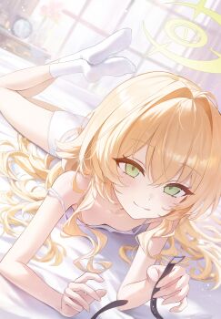 1girl absurdres bare_shoulders bed belt blonde_hair blue_archive blush breasts commentary downblouse green_eyes halo highres long_hair lying okkimon on_bed on_stomach professor_niyaniya_(blue_archive) small_breasts smile socks solo untranslatable_commentary yellow_halo