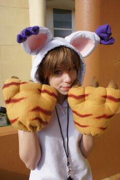 Rule 34 | 1girl, brown hair, cosplay, cosplay photo, digimon, digimon adventure, highres, lips, photo (medium), real life, smile, solo, tailmon (cosplay), yagami hikari