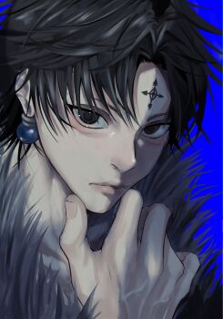 1boy black_eyes black_hair blue_background chrollo_lucilfer closed_mouth commentary_request earrings facial_mark fingernails forehead_mark fur-trimmed_jacket fur_trim hand_on_own_chin highres hunter_x_hunter jacket jewelry looking_at_viewer male_focus riperipe_apple short_hair simple_background solo veins veiny_hands
