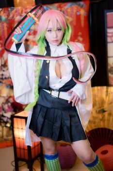 1girl braid breasts cleavage cosplay female_focus gradient_hair highres holding holding_sword holding_weapon japanese_(nationality) kanroji_mitsuri kanroji_mitsuri_(cosplay) kimetsu_no_yaiba large_breasts looking_at_viewer model multicolored_hair open_mouth photo_(medium) real_life shibuya_kaho smile solo sword tongue tongue_out twin_braids twintails weapon