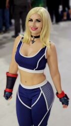 Rule 34 | 1girl, animated, audible music, bare shoulders, blonde hair, blowing kiss, breasts, cammy white, cammy white (cosplay), claubailarinita, cosplay, crop top, highres, looking at viewer, one eye closed, pants, real life, short hair, sleeveless, sound, street fighter, street fighter 6, tagme, video, wink