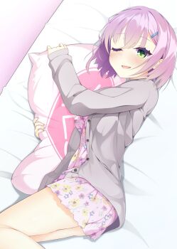 1girl ;d ass blush bob_cut cardigan commentary dutch_angle feet_out_of_frame floral_print green_eyes grey_cardigan hair_between_eyes hair_ornament hairclip highres hugging_object looking_at_viewer lying medium_hair obsidiaki official_alternate_costume on_bed on_side one_eye_closed open_cardigan open_clothes open_mouth pajamas pillow pillow_hug pink_hair pink_pajamas pink_shorts print_pajamas print_shorts shorts sleeves_past_wrists smile solo tanikaze_amane teeth tenshi_souzou_re-boot! thighs upper_teeth_only yes yes-no_pillow