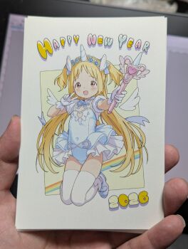 1girl 2026 :d blonde_hair blue_bow blue_bowtie blue_gem blue_leotard blue_shoes blue_skirt bow bowtie breasts cleavage cleavage_cutout clothing_cutout coattails commentary_request covered_navel detached_wings dot_nose fake_horns gem gloves hands_up happy_new_year heart_cutout highres holding holding_staff horns kneeling layered_skirt legs_together leotard light_blush long_hair looking_at_viewer magical_girl new_year open_mouth original photo_(medium) puffy_short_sleeves puffy_sleeves red_eyes shoes short_bangs short_sleeves skirt smile solo staff straight_hair tailcoat thighhighs tiara two_side_up uehara16 unicorn_horn v very_long_hair white_gloves white_skirt white_thighhighs wings