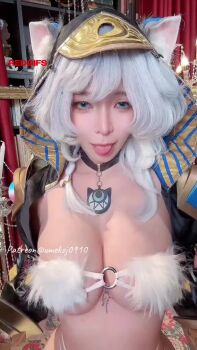 1girl animal_ears animated blue_eyes bouncing_breasts breasts cat_ears cipher_(honkai:_star_rail) cipher_(honkai:_star_rail)_(cosplay) cosplay fake_animal_ears female_focus highres honkai:_star_rail honkai_(series) indoors looking_at_viewer one_eye_closed real_life solo tongue tongue_out umekojcosplayer video vietnamese white_hair wink