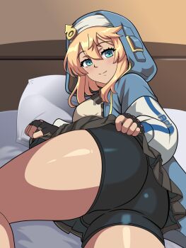 1boy 6kan arc_system_works ass bed bike_shorts black_shorts blonde_hair bridget_(guilty_gear) clothes_lift green_eyes guilty_gear guilty_gear_strive highres hood looking_at_viewer male_focus pillow shorts skirt skirt_lift solo thick_thighs thighs trap