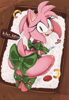 1girl amy_rose animal_ears animal_nose artist_name ass bdsm bondage bound bound_arms bound_legs box furry furry_female gift green_ribbon hairband hedgehog_girl highres in_box in_container long_hair looking_at_viewer looking_back naked_ribbon open_mouth red_hairband restrained ribbon ribbon_bondage solo sonic_(series) xiler