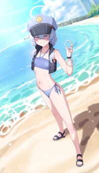 1girl absurdres beach bikini blue_archive blue_bikini blue_hair blue_halo breasts bulletproof_vest crossed_bangs cuffs full_body halo hand_on_own_hip handcuffs hat highres holding holding_handcuffs looking_at_viewer low_twintails peaked_cap police police_hat police_uniform policewoman sandals side-tie_bikini_bottom small_breasts smile standing swimsuit t-hou twintails valkyrie_police_academy_student_(sg)_(blue_archive)