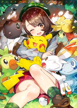 1girl animal_ears backpack bag blush brown_eyes brown_hair cardigan closed_eyes copyright_name dress gen_1_pokemon gen_8_pokemon gloria_(pokemon) green_headwear green_legwear grey_cardigan grookey hat highres horns hug long_sleeves mika_pikazo miniskirt monkey nintendo one_eye_closed open_mouth pikachu pink_dress poke_ball poke_ball_(basic) pokemon pokemon_(creature) pokemon_swsh rabbit rabbit_ears rabbit_tail scorbunny sheep shoes short_hair skirt smile sobble socks starter_pokemon_trio tail tam_o'_shanter wooloo