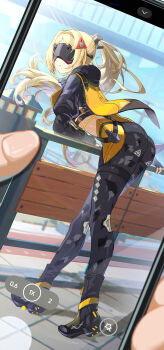 1girl 1other absurdres ass black_boots black_gloves black_pants black_shrug blindfold_mask blonde_hair blue_sky boots bupa_chila camouflage camouflage_jacket camouflage_pants cellphone closed_mouth commentary covered_eyes day dutch_angle eye_mask facing_viewer fingerless_gloves floating_hair full_body gloves hair_ornament highres hood hood_down jacket long_hair mask pants phone ponytail pov pov_hands shrug_(clothing) sky smartphone smile tight_clothes tight_pants trigger_(zenless_zone_zero) wind zenless_zone_zero