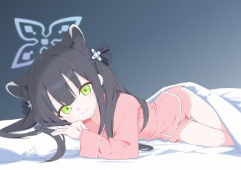 1girl animal_ear_fluff animal_ears bed bed_sheet black_hair blue_archive blue_halo commentary extra_ears green_eyes halo highres lying on_bed on_side pajamas pillow pink_pajamas shun_(blue_archive) shun_(small)_(blue_archive) smile symbol-only_commentary tiger_ears tiger_girl torimew twintails