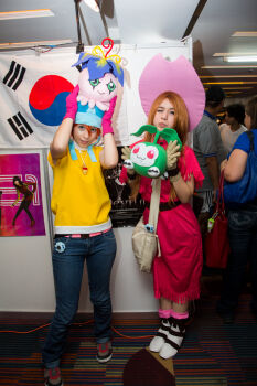 Rule 34 | 2girls, cosplay photo, denim, digimon, digimon adventure, digivice, dress, jeans, multiple girls, pants, photo (medium), real life, red dress, stuffed toy, tachikawa mimi, takenouchi sora