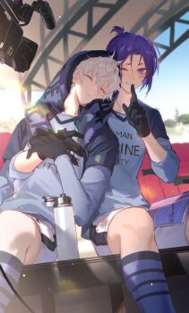 2boys black_gloves blue_lock blue_socks bottle camera closed_mouth commentary_request doran_(doran7280) finger_to_mouth gloves hair_between_eyes highres looking_at_viewer male_focus manshine_city_soccer_uniform mikage_reo multiple_boys nagi_seishirou one_eye_closed purple_eyes purple_hair short_hair shushing sitting sleeping sleeping_on_person soccer_uniform socks sportswear teeth towel towel_on_head water_bottle white_hair