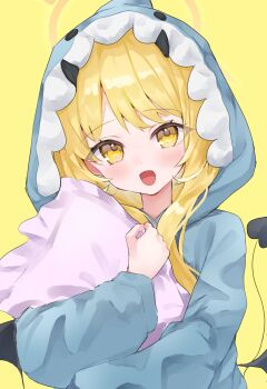 1girl animal_costume black_horns black_wings blonde_hair blue_archive blush demon_tail dot_nose halo highres hood hood_up horns hugging_object ibuki_(blue_archive) long_hair looking_at_viewer noko_(nco029685627) open_mouth pillow pillow_hug pink_halo shark_costume simple_background solo tail tail_raised upper_body wings yellow_background yellow_eyes