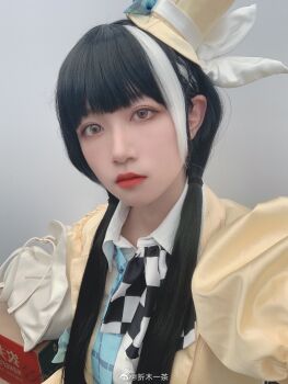 Rule 34 | 1girl, absurdres, against wall, chinese commentary, commentary request, cosplay photo, dress, girls' frontline, hat, highres, long hair, multicolored eyes, multicolored hair, oreki issa, photo (medium), red lips, ro635 (girls' frontline), scarf, shirt, solo, twintails, upper body, white shirt, yellow dress