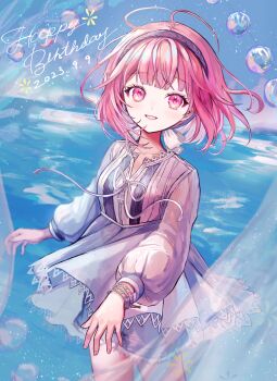 absurdres blunt_bangs bow bubble commentary_request dress floating_hair hairband happy_birthday highres long_sleeves looking_at_viewer medium_hair ootori_emu pink_eyes pink_hair pipi_(pipinavigation) project_sekai purple_hairband ribbon smile water white_bow white_dress white_ribbon wristband