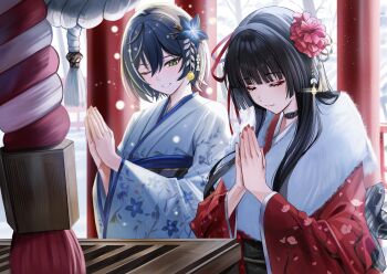 2girls alternate_costume black_choker black_flower black_hair blake_bloom_(wuthering_waves) chisa_(wuthering_waves) choker closed_eyes commentary flower hair_between_eyes hair_flower hair_ornament hair_ribbon highres japanese_clothes kimono long_hair multiple_girls nicky_w one_eye_closed outdoors palms_together parted_lips red_kimono red_ribbon ribbon sayuki_(wuthering_waves) smile snow symbol-only_commentary torii white_kimono wuthering_waves