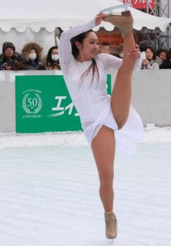 1girl andou_miki company_logo figure_skating leotard photo_(medium) split standing standing_on_one_leg standing_split white_leotard