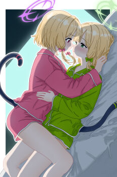 blonde_hair blue_archive blush bow cat_tail commentary english_commentary green_eyes green_halo green_shirt green_shorts hair_bow halo highres incest krusthien looking_at_another lying lying_on_person mechanical_tail midori_(blue_archive) momoi_(blue_archive) on_bed open_mouth parted_lips pink_eyes pink_halo pink_shirt pink_shorts shirt short_hair shorts tail thighs yuri