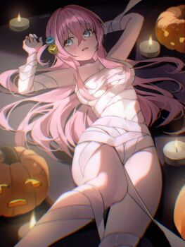 1girl arm_behind_head bandages blue_eyes blush bocchi_the_rock! breasts candle cube_hair_ornament gotoh_hitori hair_ornament halloween halloween_costume hand_up highres jack-o&#039;-lantern long_hair lying mummy_costume naked_bandage navel on_back one_side_up open_mouth pink_hair pumpkin rounizm solo thighs