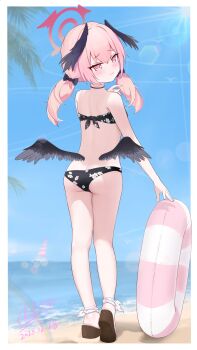 1girl absurdres ass beach bikini black_bikini black_wings blue_archive blue_sky cloud day feathered_wings floral_print floral_print_bikini from_behind full_body halo head_wings highres horizon innertube koharu_(blue_archive) koharu_(swimsuit)_(blue_archive) long_hair looking_at_viewer looking_back low_twintails low_wings ocean official_alternate_costume outdoors pink_eyes pink_hair pink_halo print_bikini sichuan_luo_li sky solo swim_ring swimsuit twintails wings