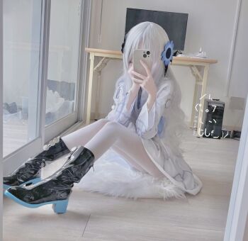1girl anemone_(flower) black_boots blue_flower blunt_bangs boots cellphone cosplay_photo covering_face dal_(aazsxx2) dress flower gradient_clothes hair_flower hair_ornament hair_over_one_eye highres holding holding_phone indoors isekaijoucho kamitsubaki_studio legs_together long_hair long_sleeves mirror_selfie pantyhose petite phone phone_over_face photo_(medium) rug selfie solo two-tone_dress virtual_youtuber wavy_hair white_dress white_hair white_pantyhose