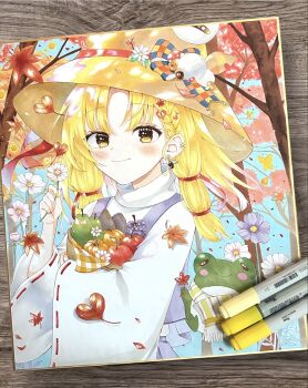 1girl apple autumn_leaves blonde_hair blue_sky blush bow brown_hat closed_mouth commentary_request dappled_sunlight day earrings falling_leaves fingernails flower food forehead forest frog fruit grapes hair_ornament hair_ribbon hat hat_bow heart heart_hair_ornament highres holding holding_flower holding_food holding_fruit jewelry leaf leaf_hair_ornament light_smile long_hair long_sleeves looking_at_viewer marker_(medium) moriya_suwako multicolored_bow nail_polish nature outdoors parted_bangs photo_(medium) purple_flower red_ribbon ribbon ringo33757 shikishi shirt sky solo sunlight touhou traditional_media tree turtleneck turtleneck_shirt white_flower white_shirt wide_sleeves yellow_eyes yellow_nails